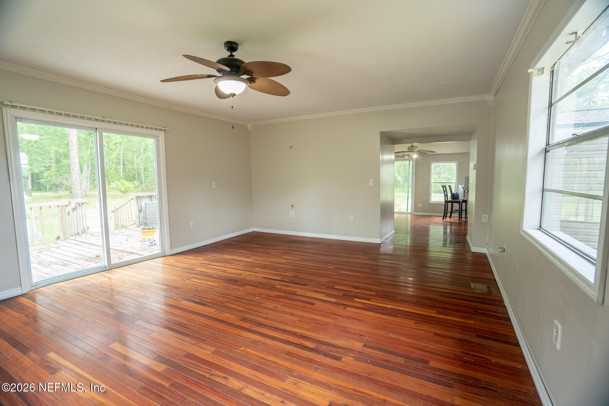 3180 Pacetti Road, Unit A St. Augustine, FL 32092 - Photo 18 of 23 a view of empty room with wooden floor and fan