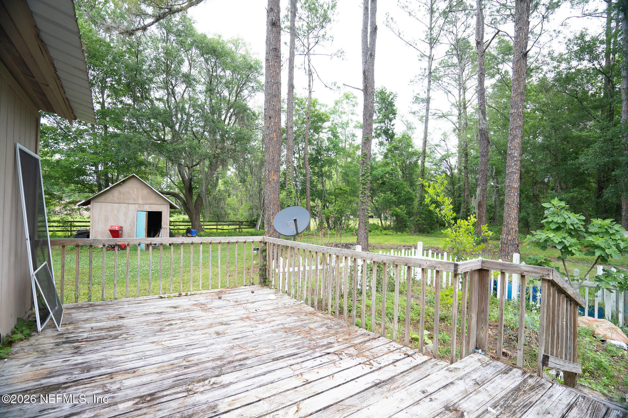 3180 Pacetti Road, Unit A St. Augustine, FL 32092 - Photo 19 of 23 a view of a wooden deck and a yard