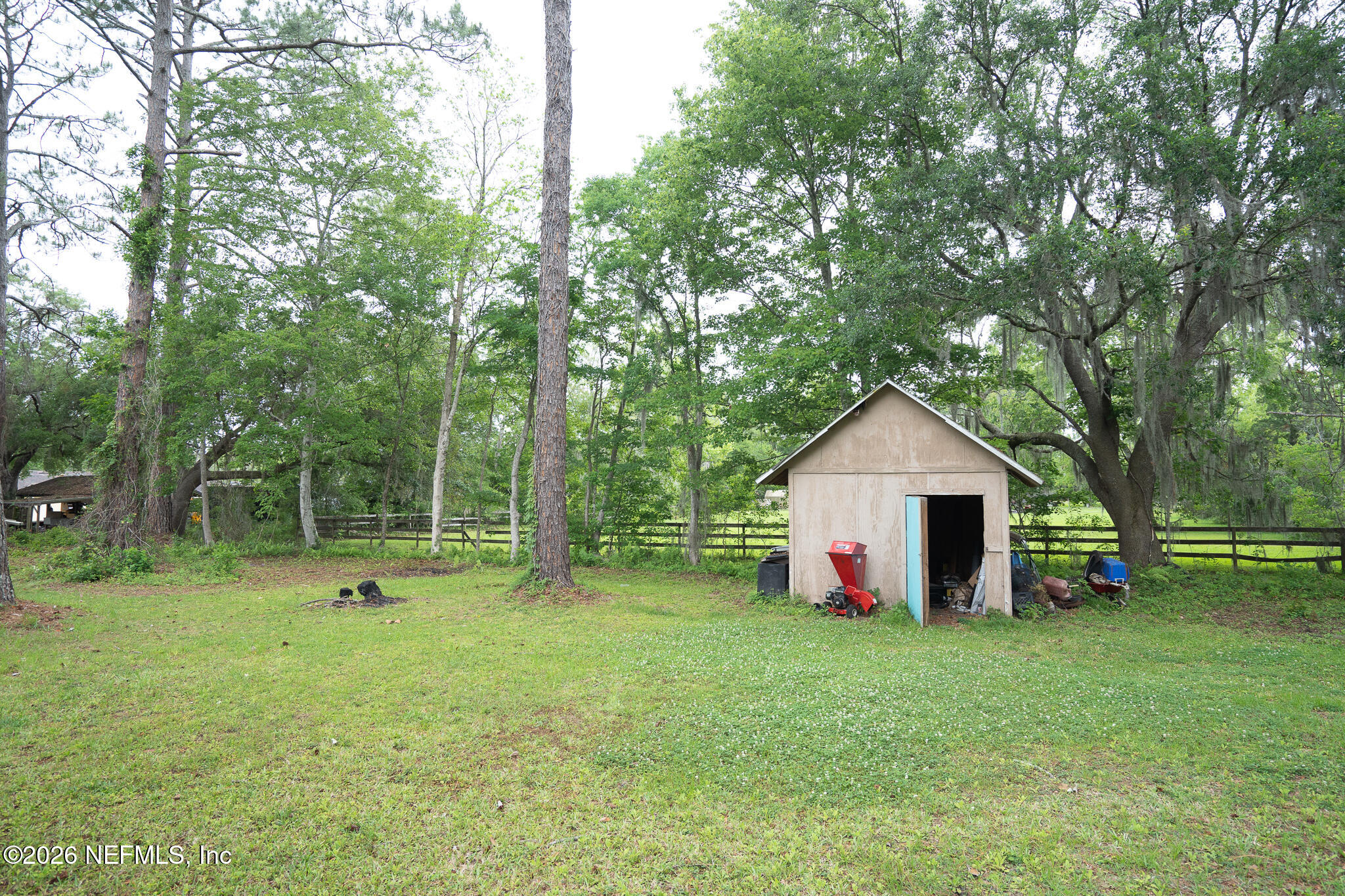 3180 Pacetti Road, Unit A St. Augustine, FL 32092 - Photo 20 of 23 a view of outdoor space with garden and trees