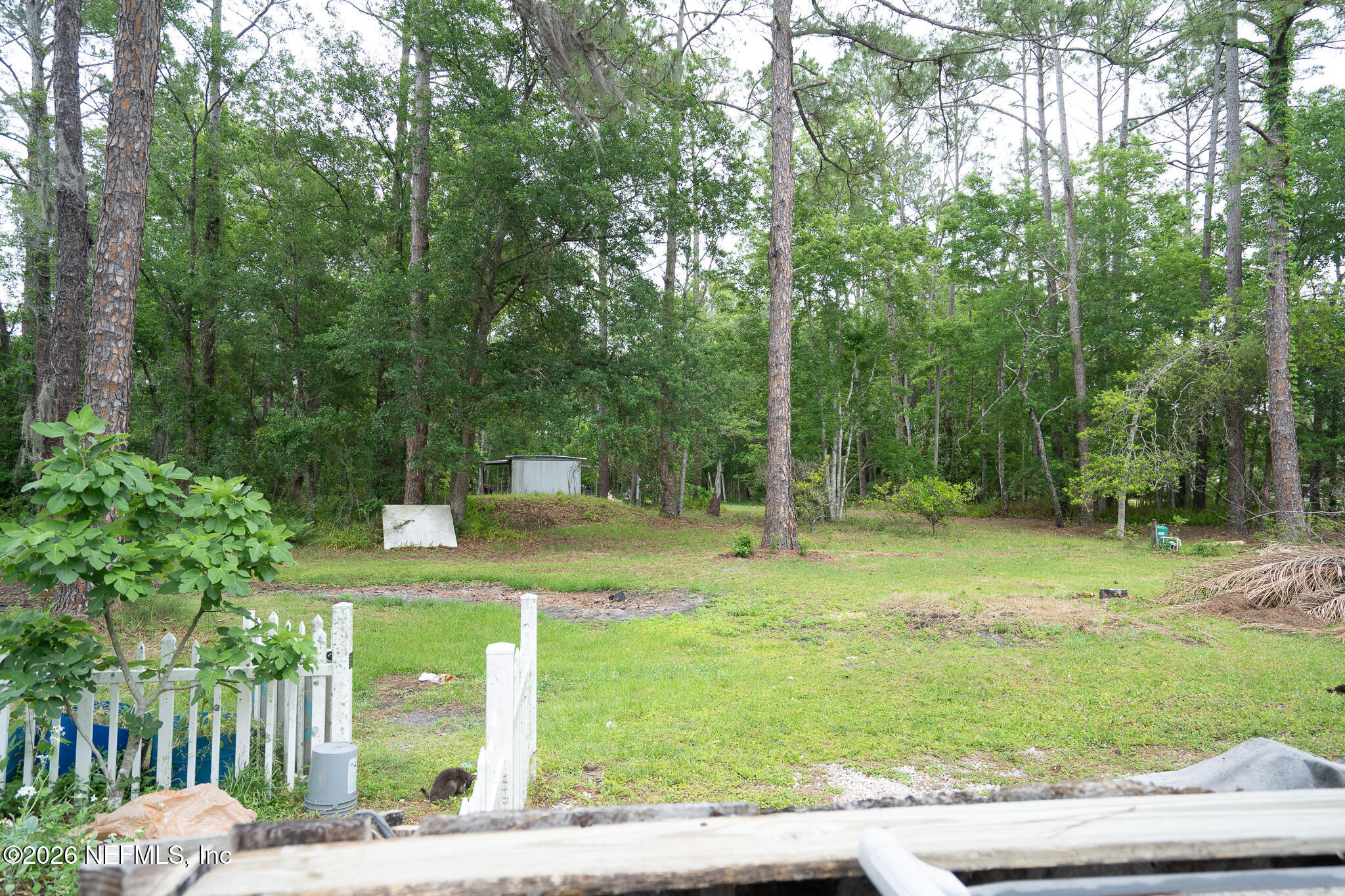 3180 Pacetti Road, Unit A St. Augustine, FL 32092 - Photo 21 of 23 a view of a house with a yard