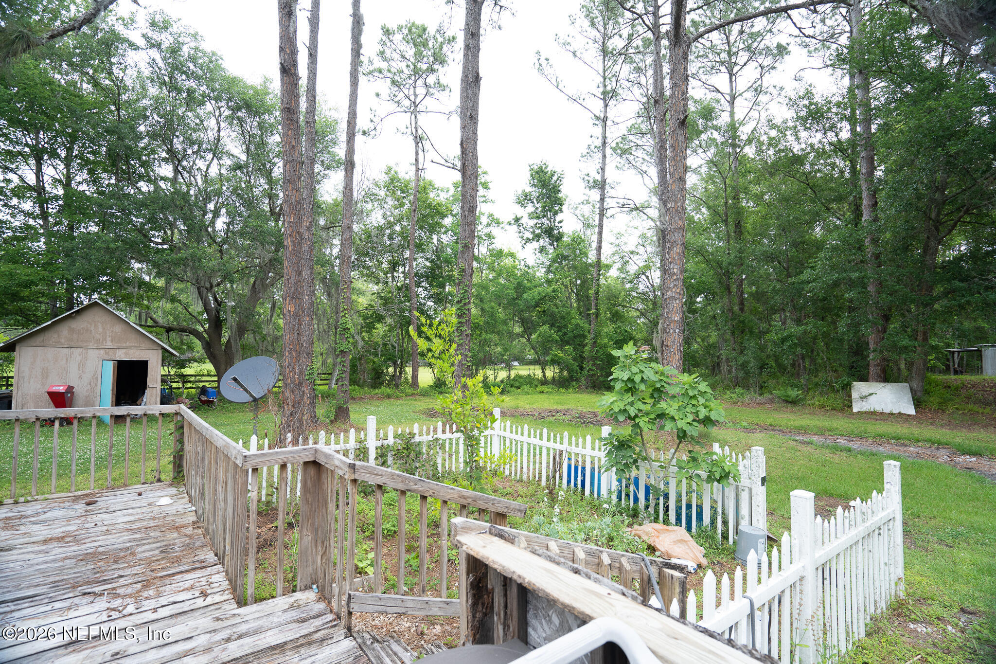 3180 Pacetti Road, Unit A St. Augustine, FL 32092 - Photo 22 of 23 a view of a deck and garden