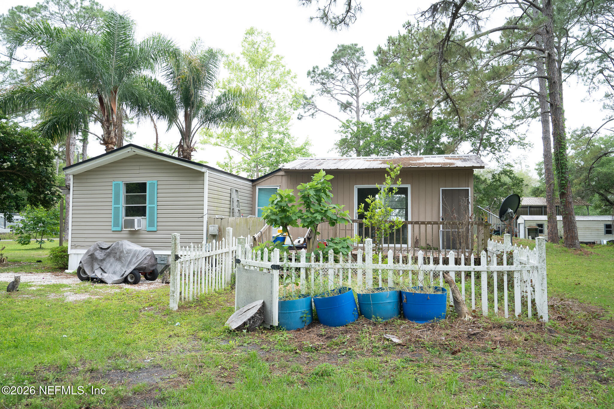 3180 Pacetti Road, Unit A St. Augustine, FL 32092 - Photo 23 of 23 a view of a house with a yard porch and furniture
