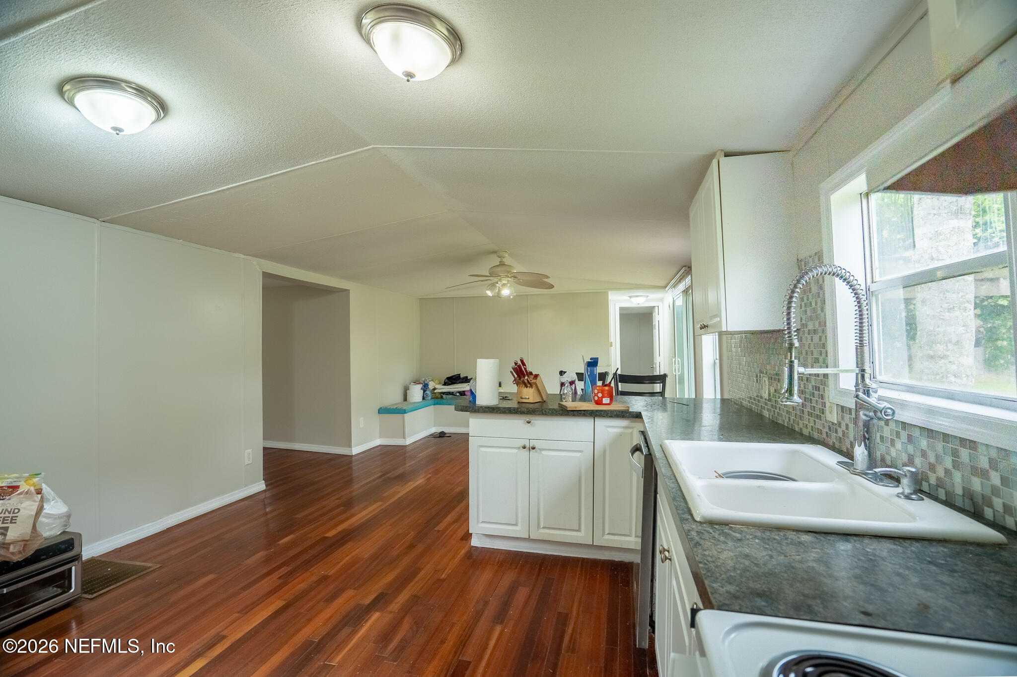 3180 Pacetti Road, Unit A St. Augustine, FL 32092 - Photo 7 of 23 a kitchen with sink and cabinets