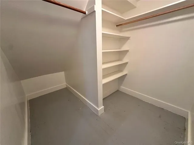 a view of an empty walk in closet