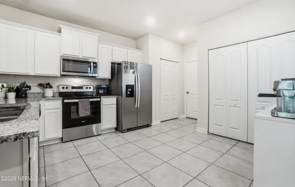 a view of cabinets and utility room