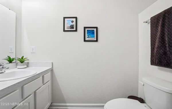 a bedroom with bed and a desk
