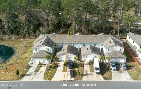 aerial view of a house with a view of the trees