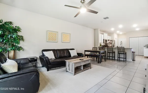 a living room with furniture and a window