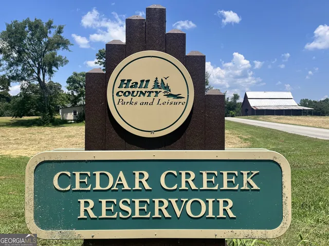 a sign that is on a brick wall with a signage