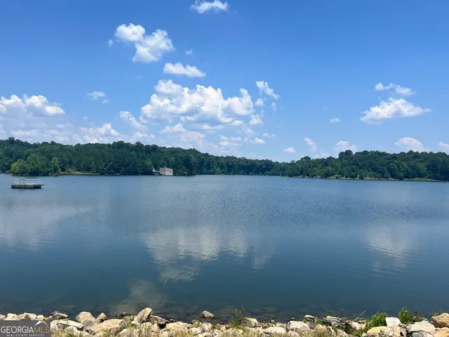 a view of lake with green space