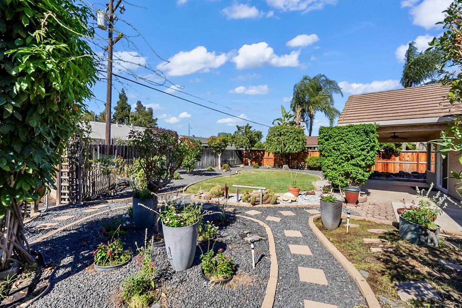 1163 Bailey Drive Ripon, CA 95366 - Photo 29 of 37 Meandering garden pathways create a peaceful backyard retreat.