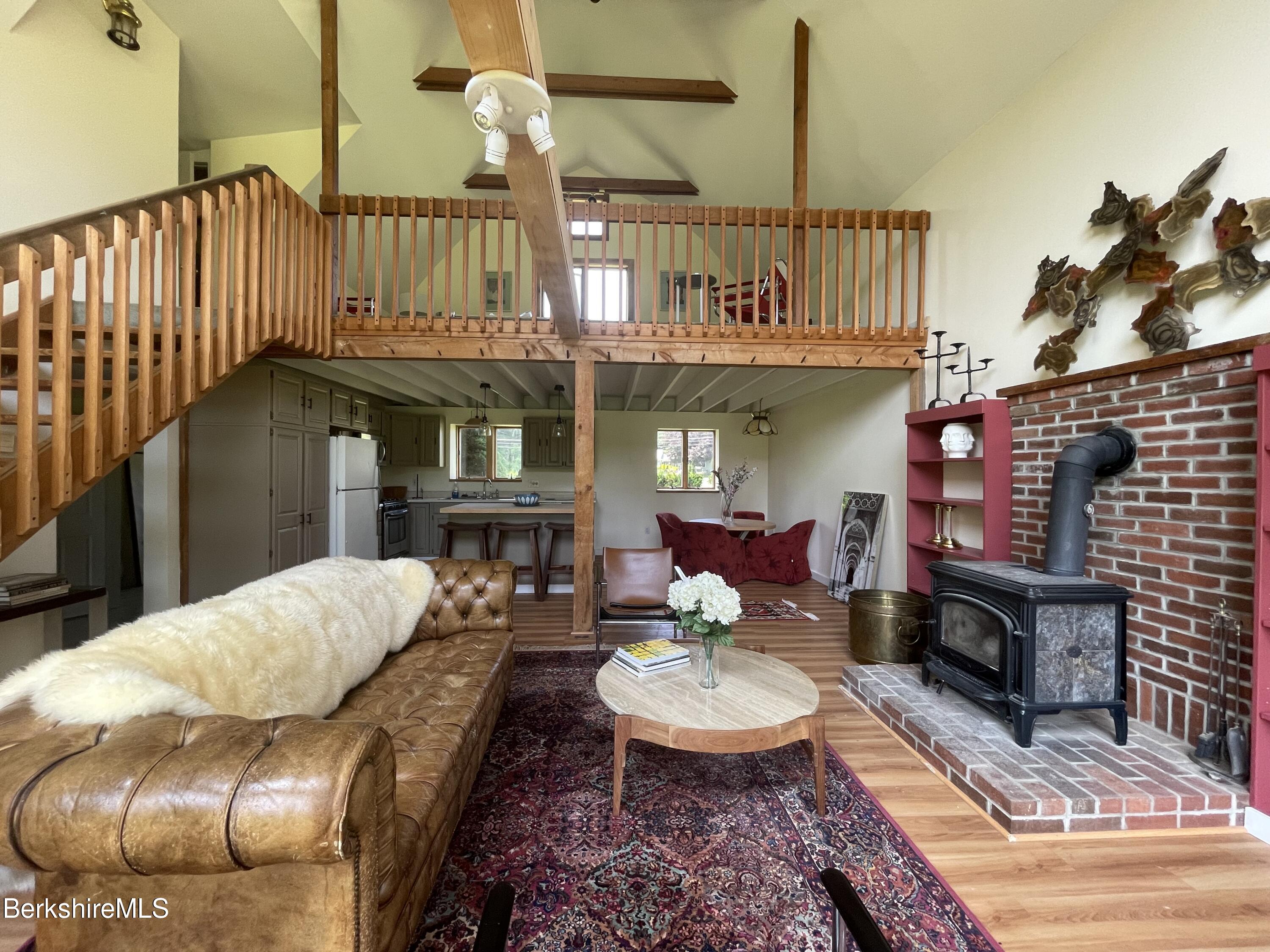 259 Salisbury Road Sheffield, MA 01257 - Photo 19 of 51 a living room with furniture and a fireplace