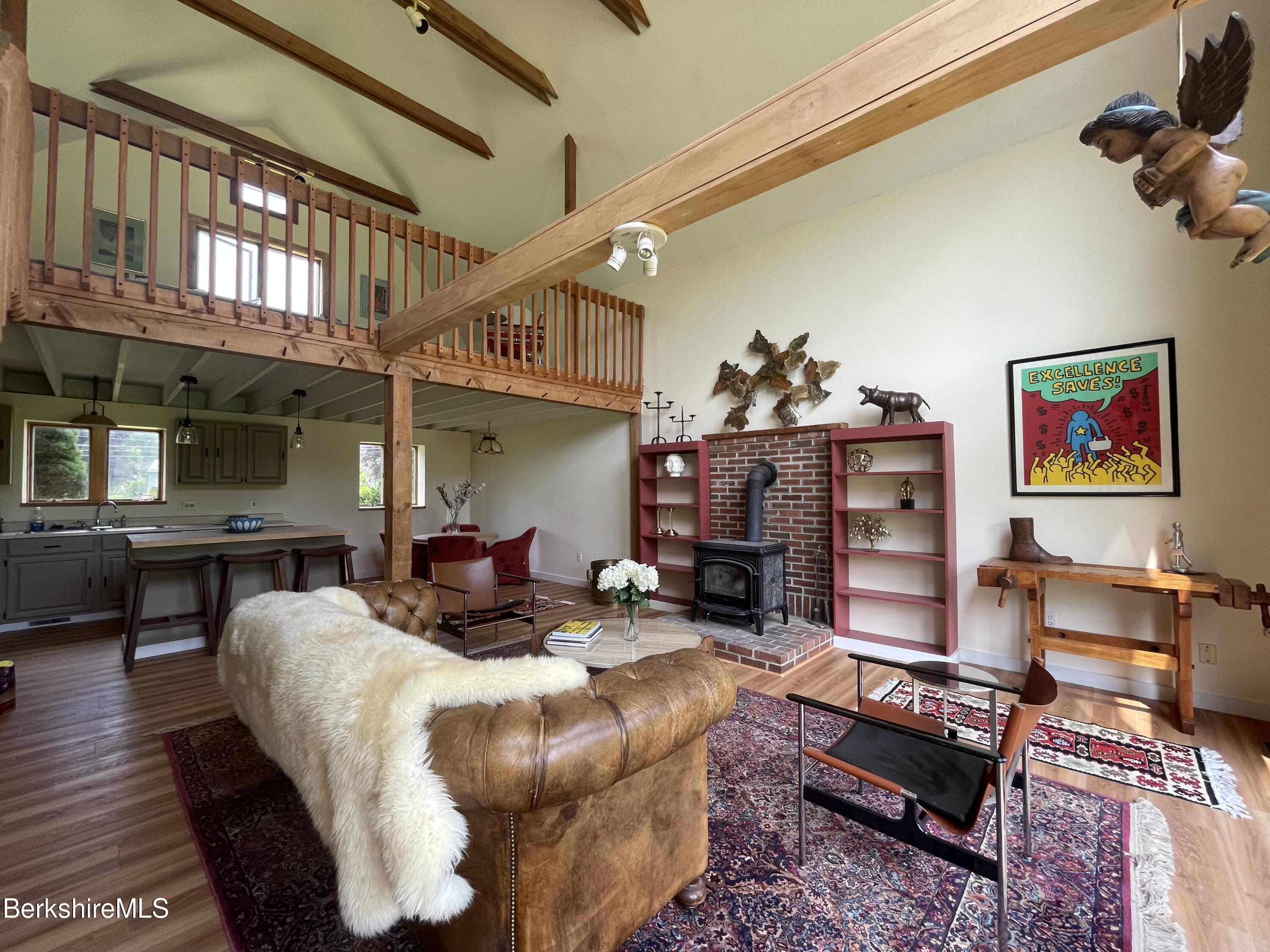 259 Salisbury Road Sheffield, MA 01257 - Photo 2 of 51 a living room with furniture a fireplace and a flat screen tv