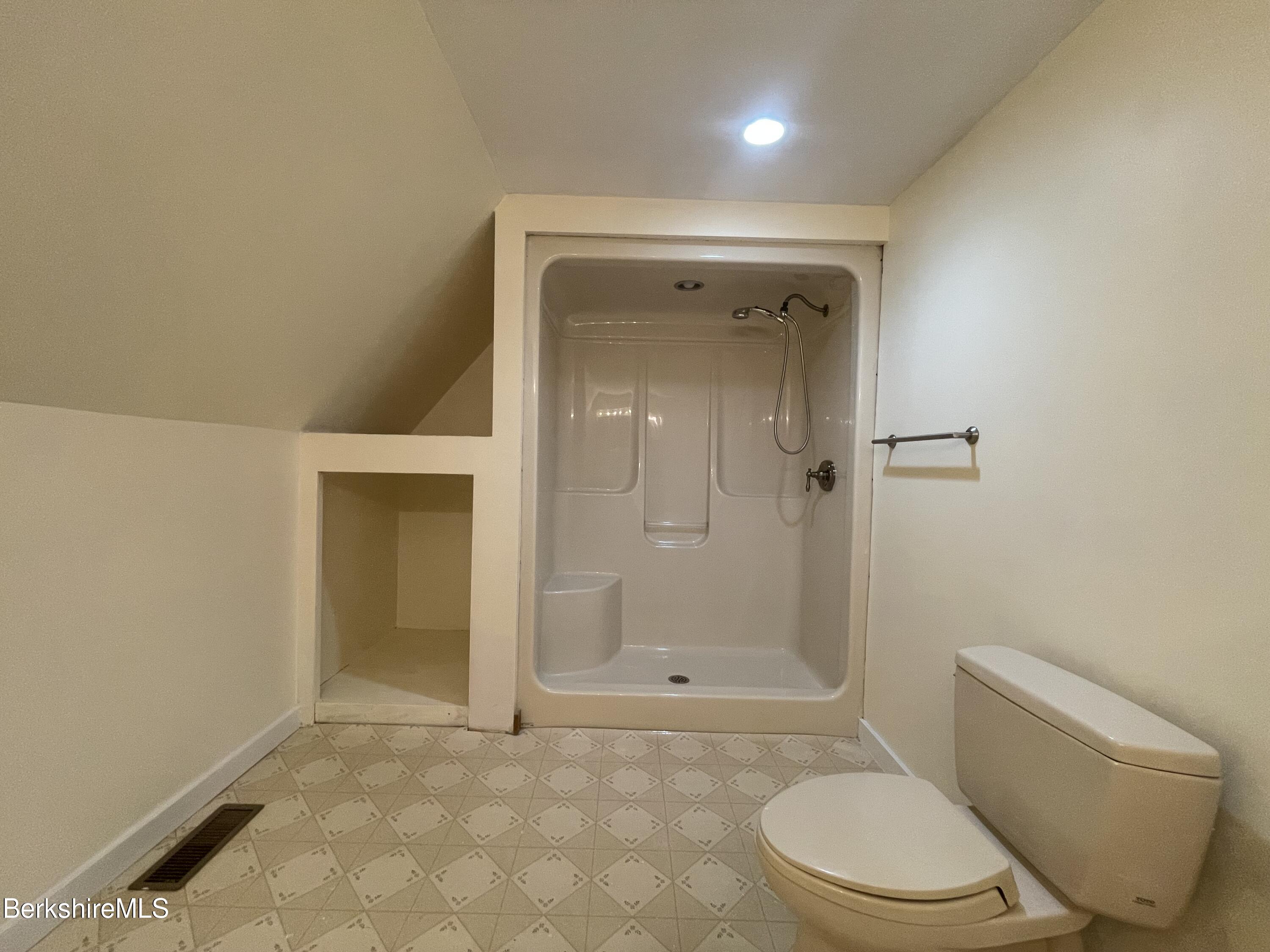259 Salisbury Road Sheffield, MA 01257 - Photo 40 of 51 a bathroom with a granite countertop toilet and a shower