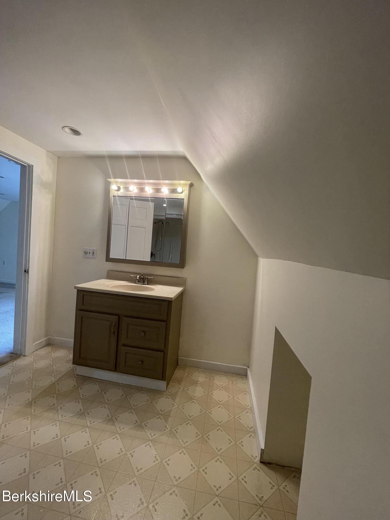 259 Salisbury Road Sheffield, MA 01257 - Photo 41 of 51 a spacious bathroom with a vanity and a mirror