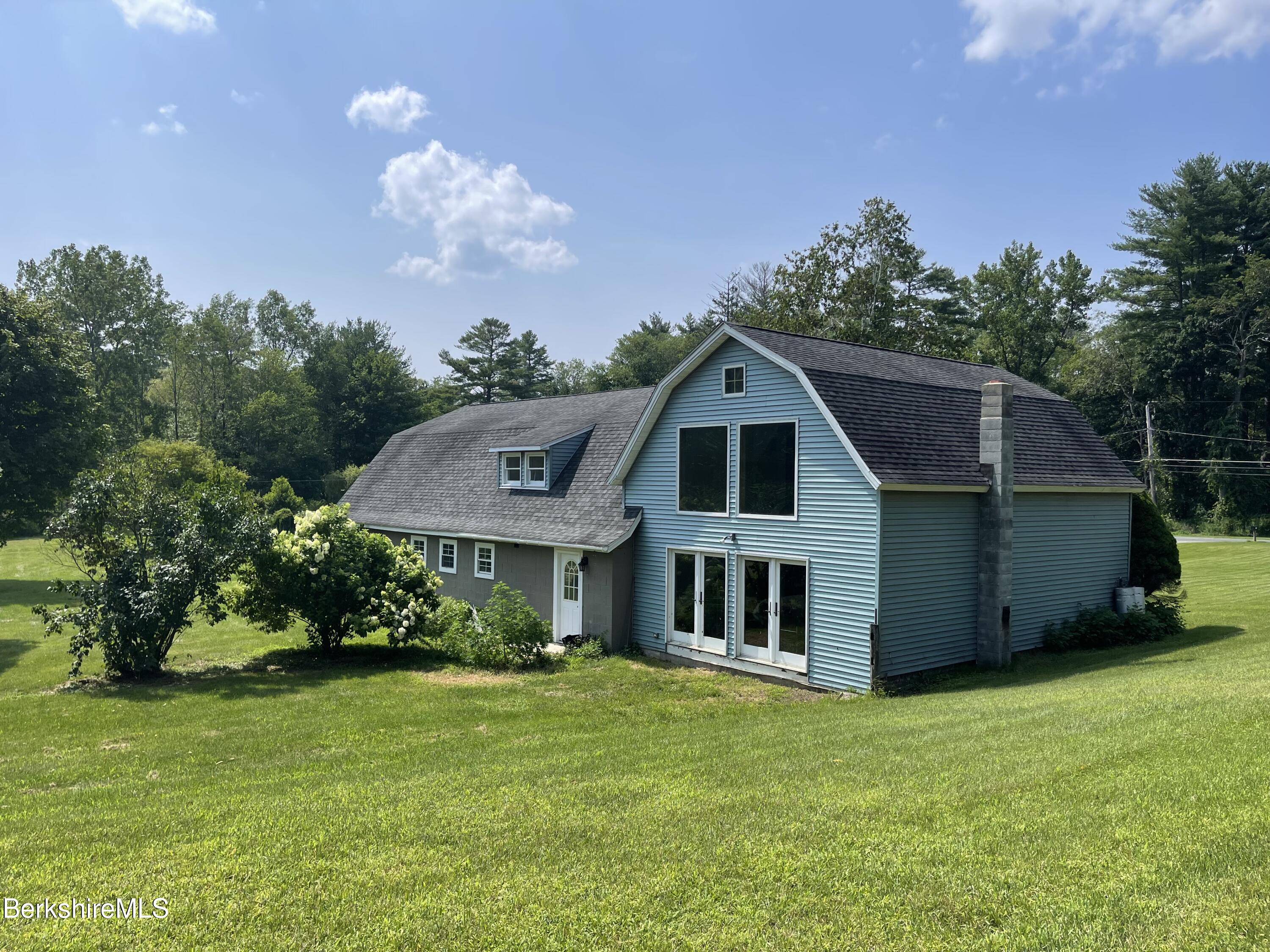 259 Salisbury Road Sheffield, MA 01257 - Photo 9 of 51 a view of a house with a big yard potted plants and large tree