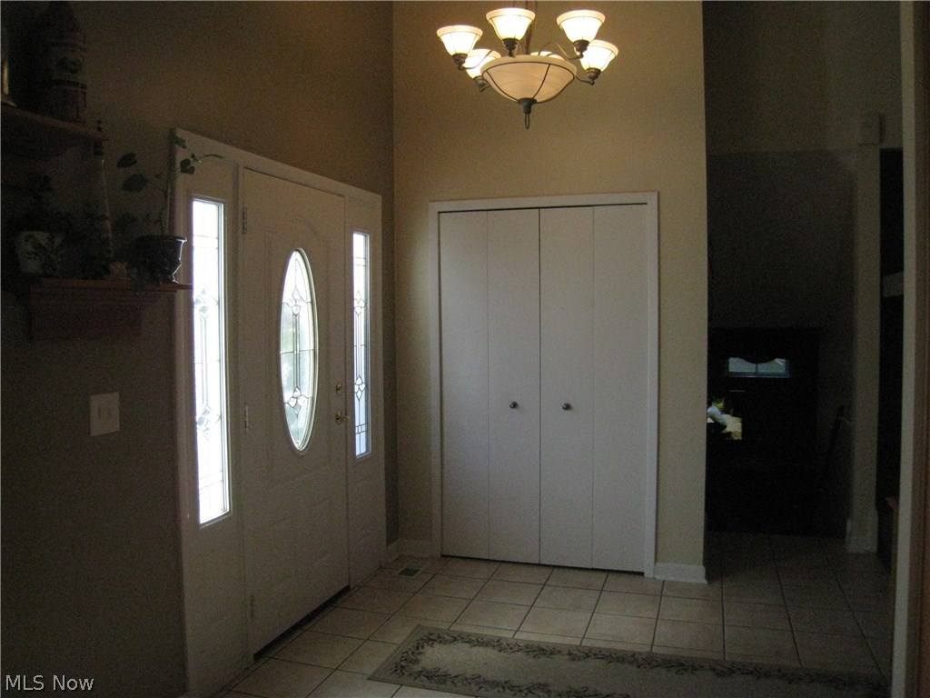 8087 Munson Road Mentor, OH 44060 - Photo 3 of 23 Vaulted foyer with guest closet, ceramic floor.