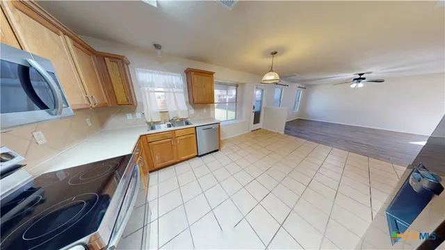a spacious bathroom with a double vanity sink a mirror and a shower