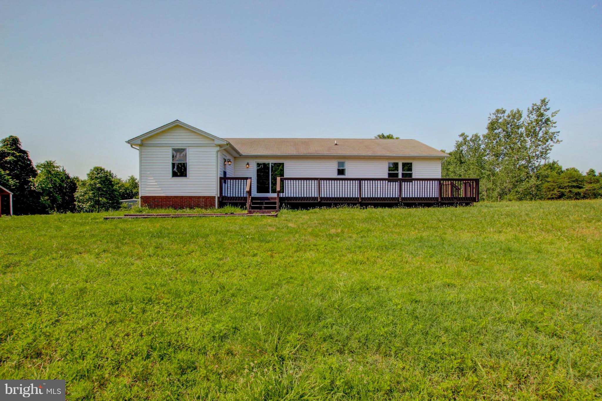 3117 Partlow Road Partlow, VA 22534 - Photo 6 of 30 a view of a house with a yard and sitting area
