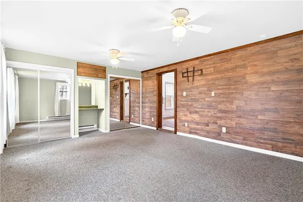 a view of empty room with ceiling fan
