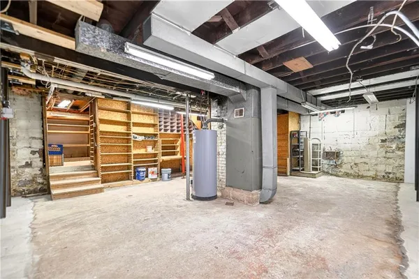 a view of an empty room with wooden walls