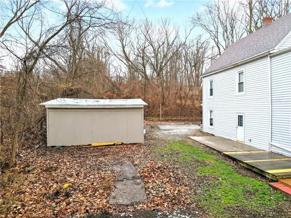 an aerial view of a house with outdoor space
