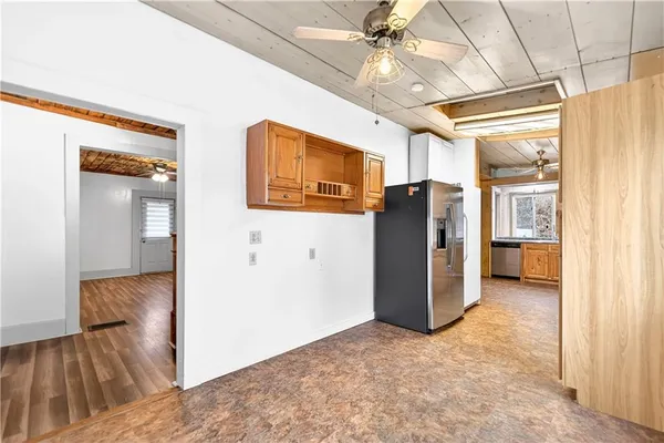 a view of a hallway with closet and cabinet