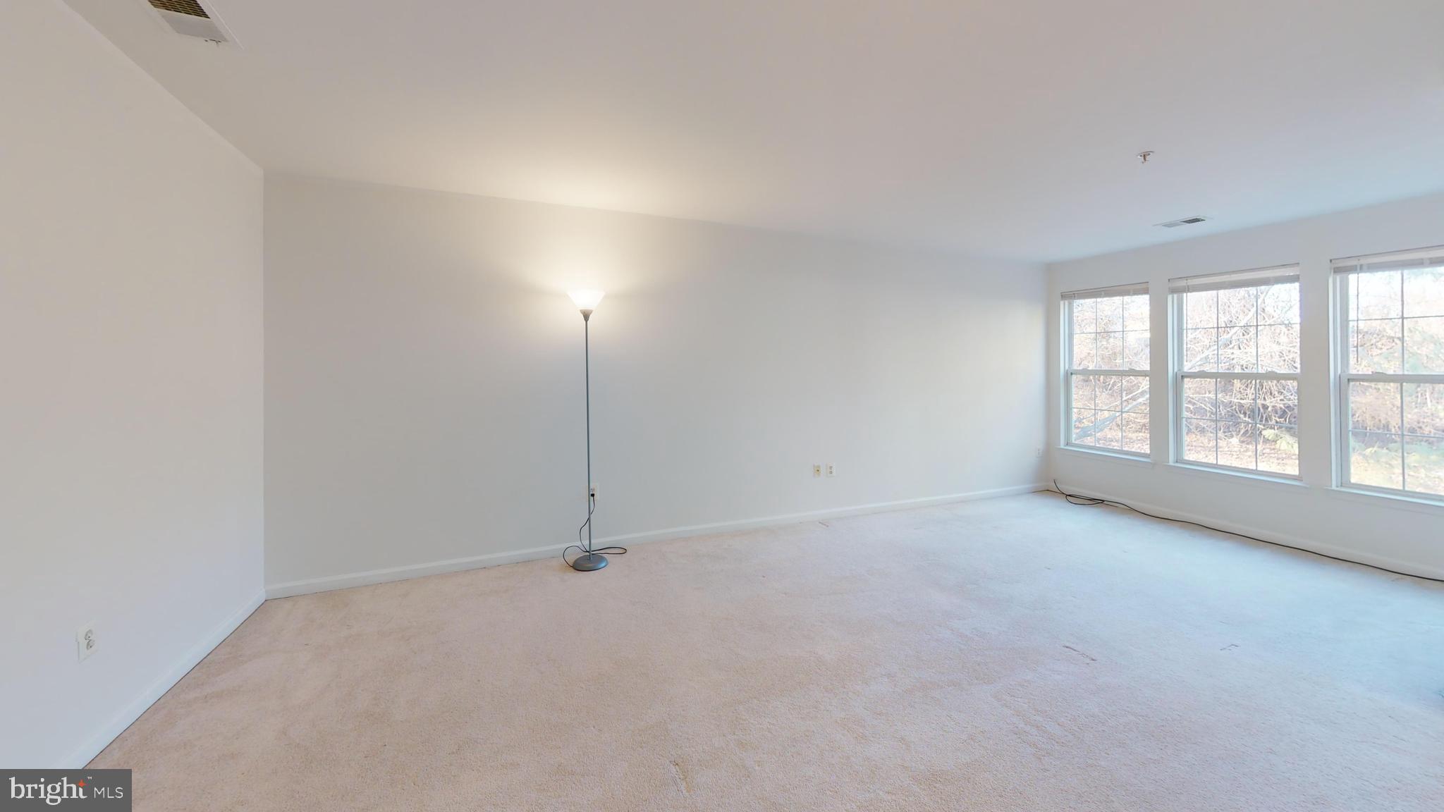 26071 Ridge Manor Drive Damascus, MD 20872 - Photo 15 of 29 wooden floor in an empty room with a window