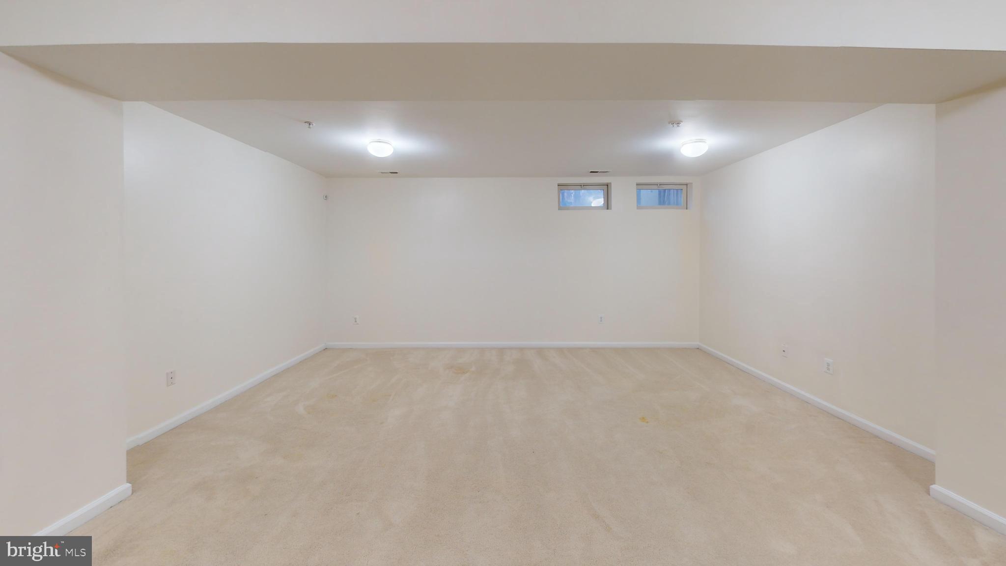 26071 Ridge Manor Drive Damascus, MD 20872 - Photo 18 of 29 an empty room with a empty space and windows