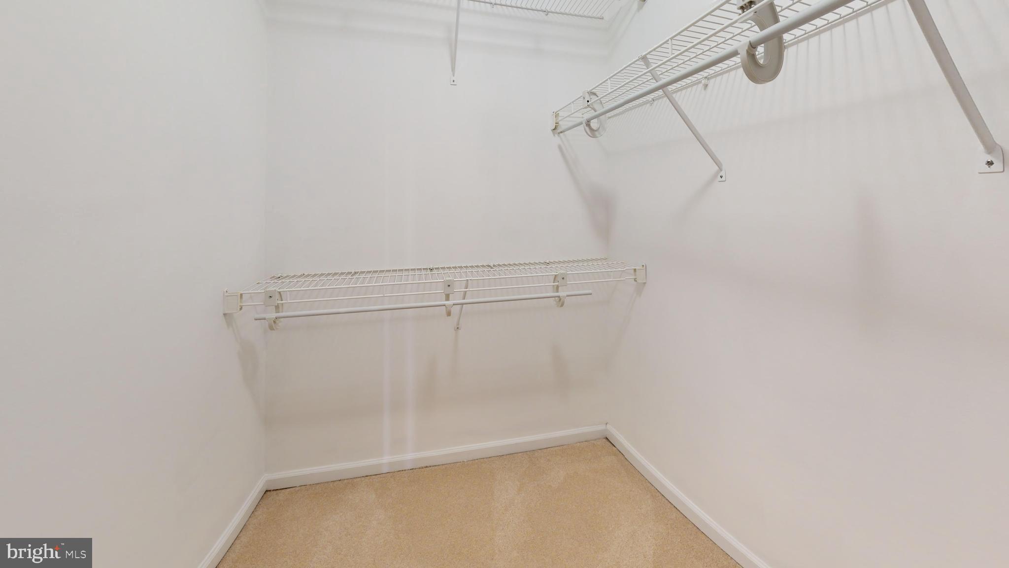 26071 Ridge Manor Drive Damascus, MD 20872 - Photo 20 of 29 a view of a room with racks on the wall