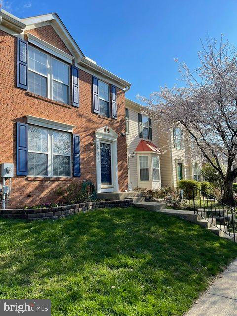 26071 Ridge Manor Drive Damascus, MD 20872 - Photo 2 of 29 a front view of a house with a yard