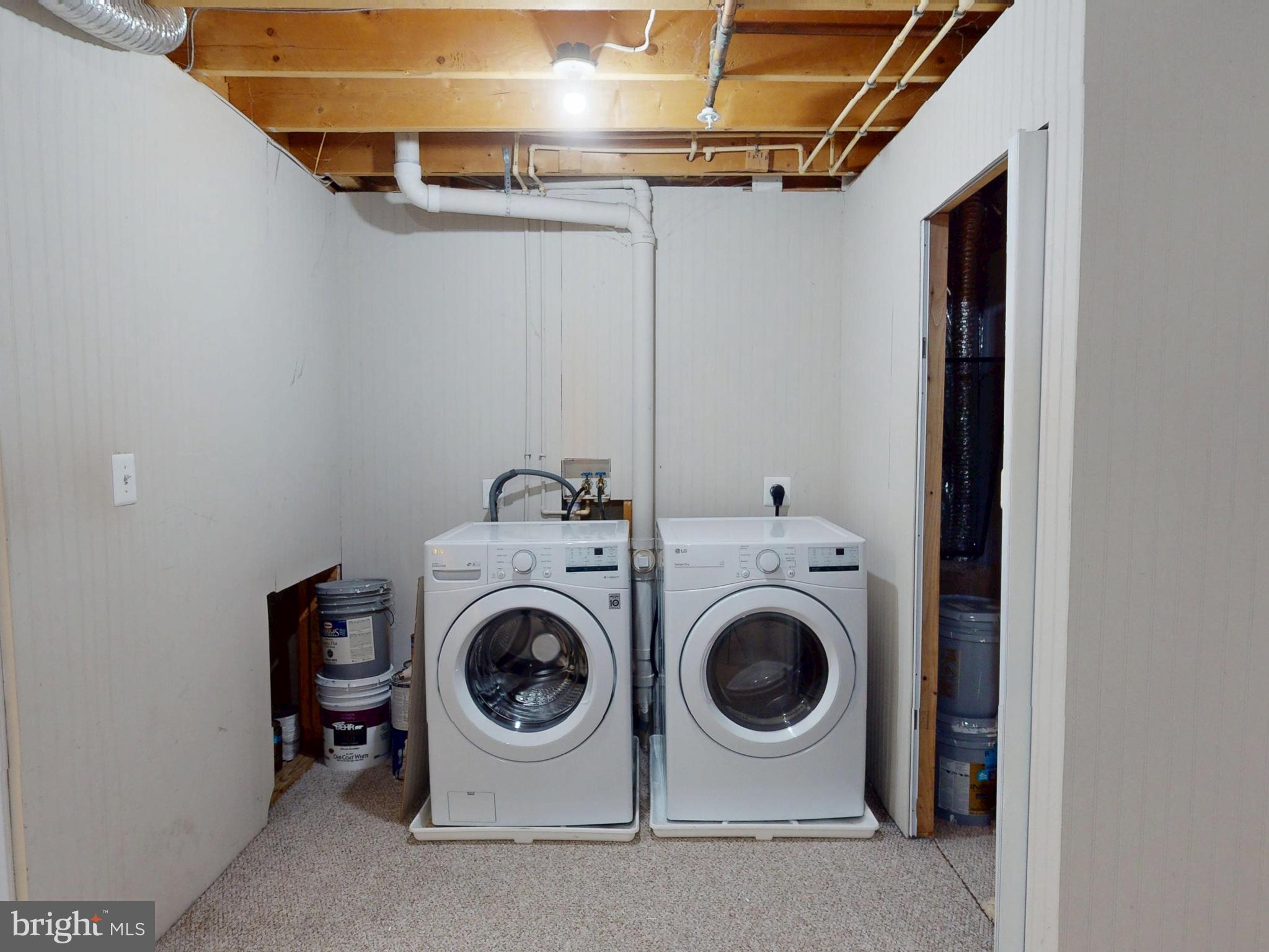26071 Ridge Manor Drive Damascus, MD 20872 - Photo 25 of 29 a utility room with dryer and washer