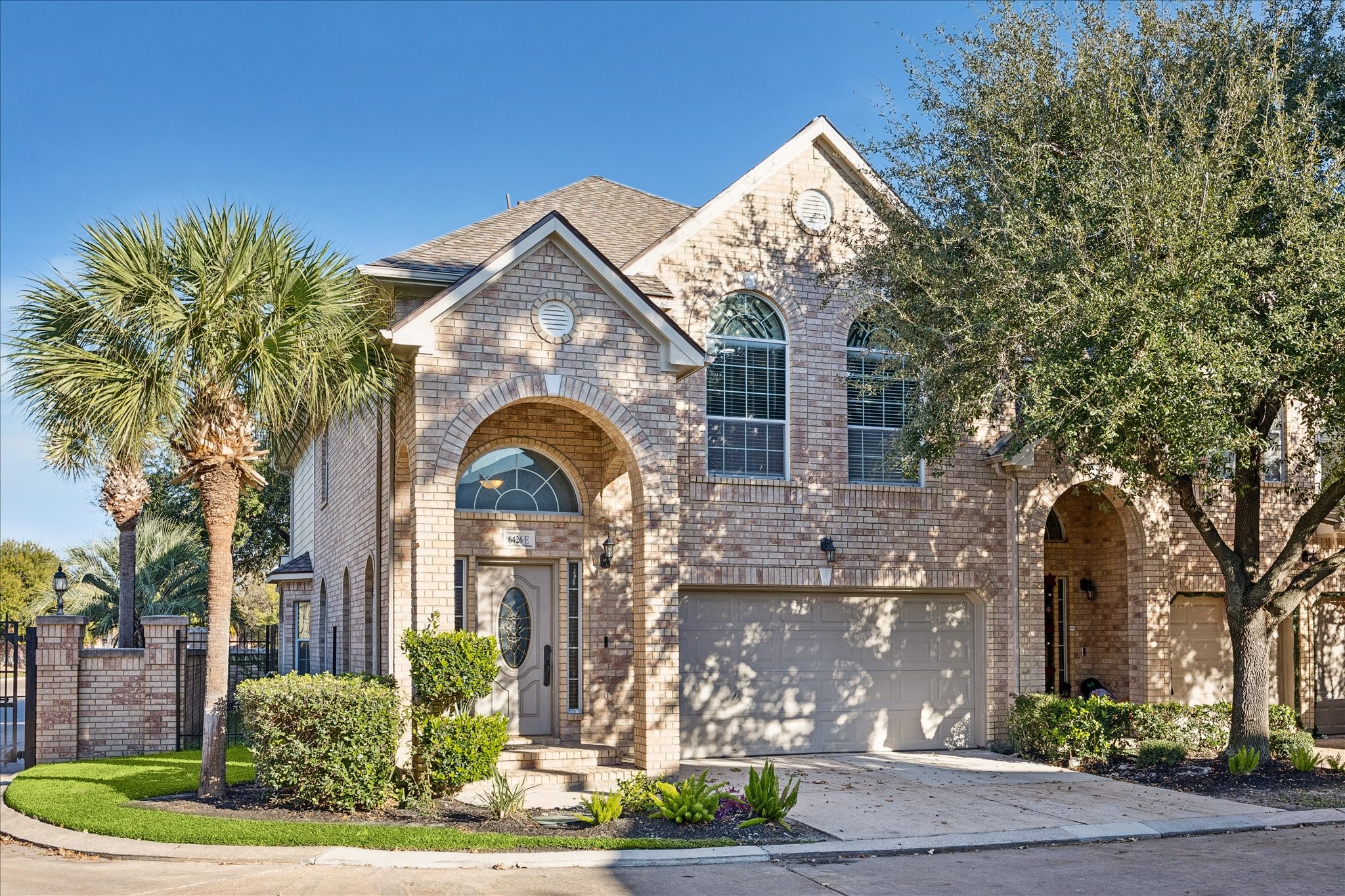 6426 East Linpar Court Houston, TX 77040 - Photo 1 of 23 a front view of a house with a garden