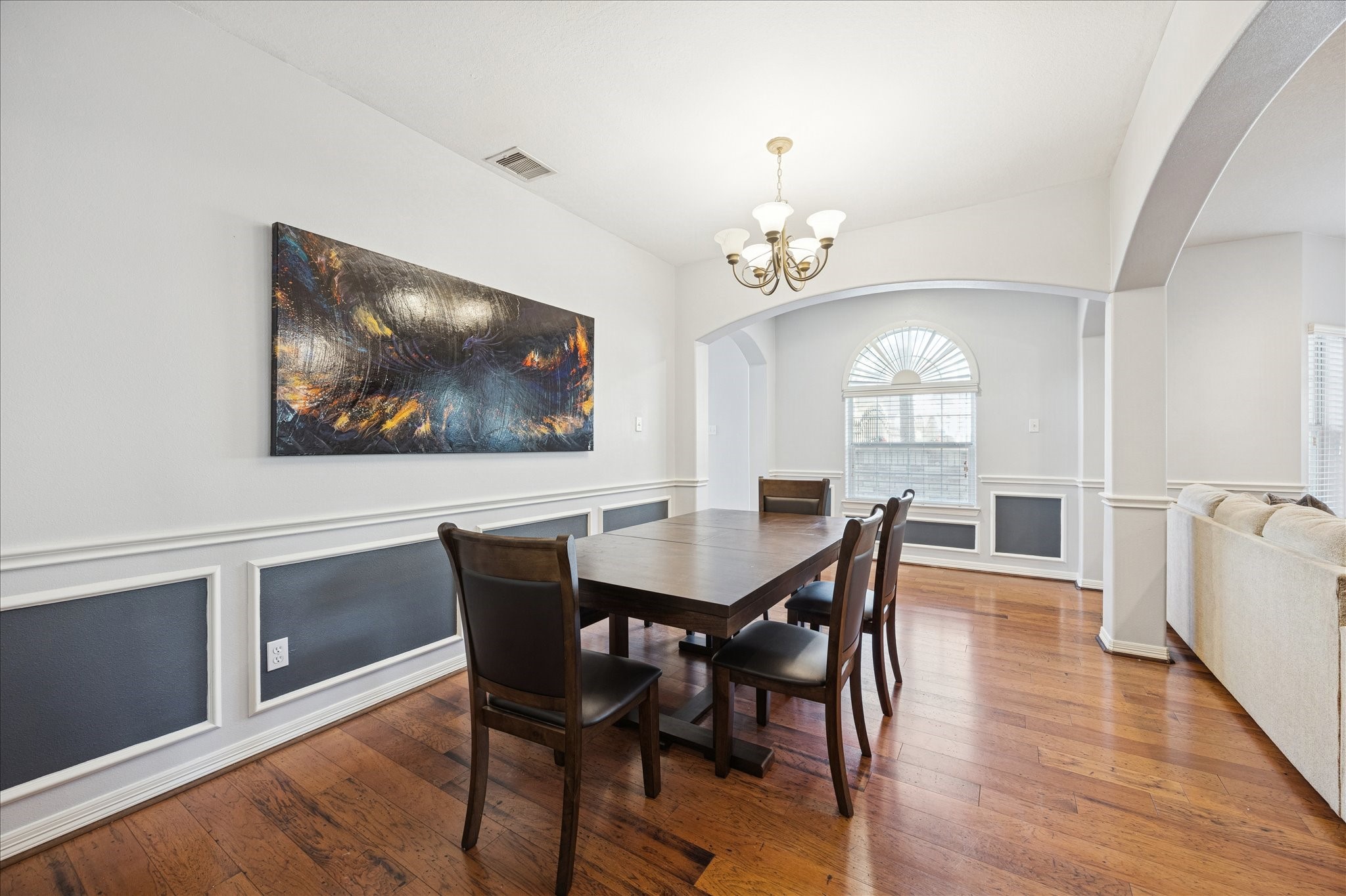 6426 East Linpar Court Houston, TX 77040 - Photo 6 of 23 a view of a dining room with furniture wooden floor and chandelier
