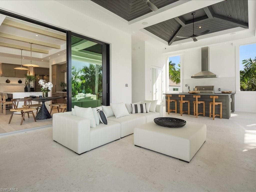 612 Binnacle Drive Naples, FL 34103 - Photo 15 of 50 Living room with a high ceiling, beam ceiling, ceiling fan, and recessed lighting