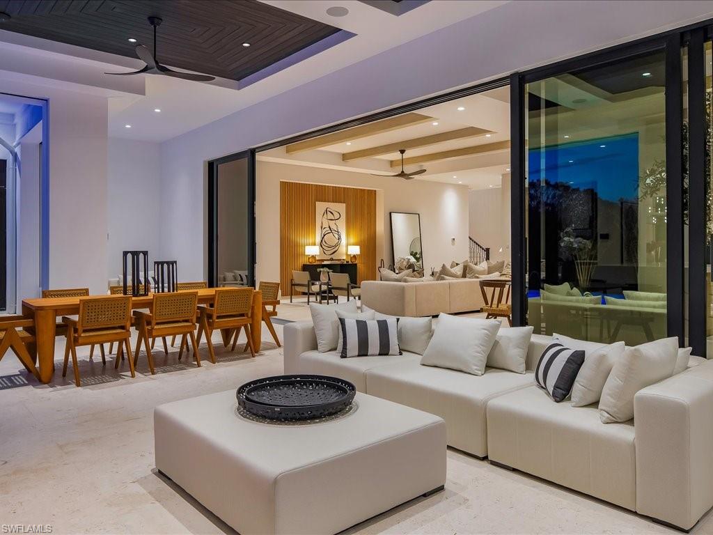 612 Binnacle Drive Naples, FL 34103 - Photo 25 of 50 Living area with beamed ceiling, recessed lighting, and a ceiling fan