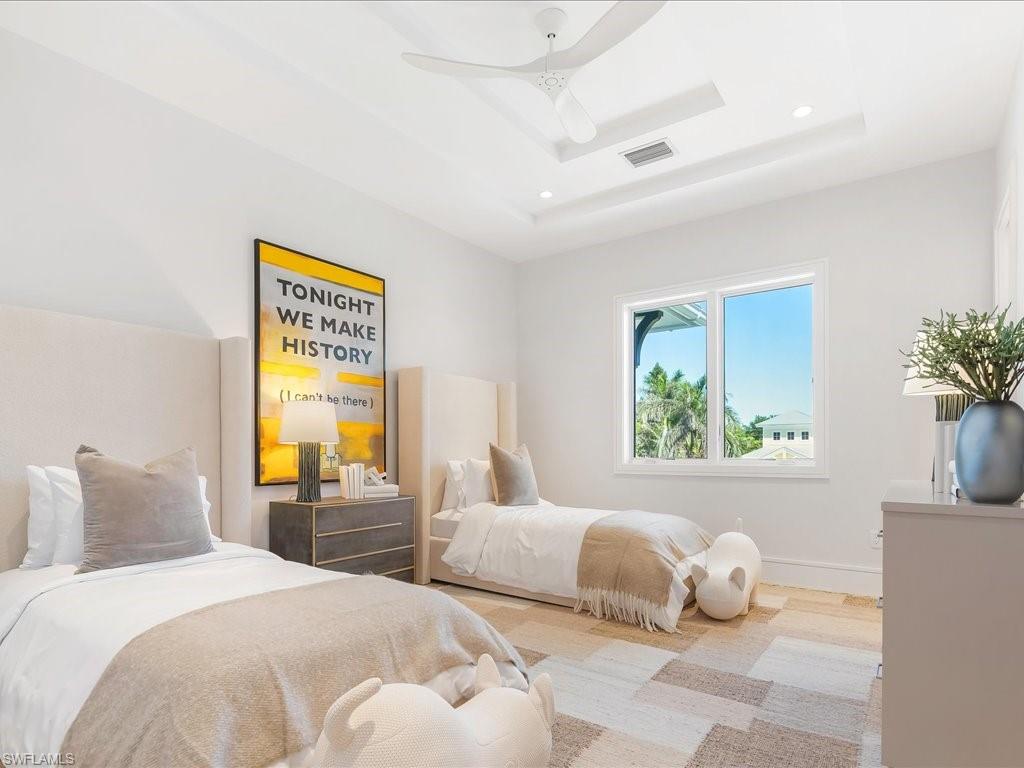 612 Binnacle Drive Naples, FL 34103 - Photo 48 of 50 Bedroom featuring a tray ceiling, recessed lighting, baseboards, a skylight, and visible vents