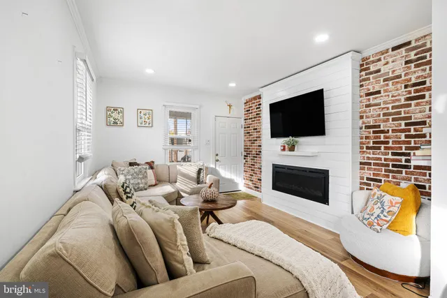 a spacious bedroom with a bed and a flat screen tv