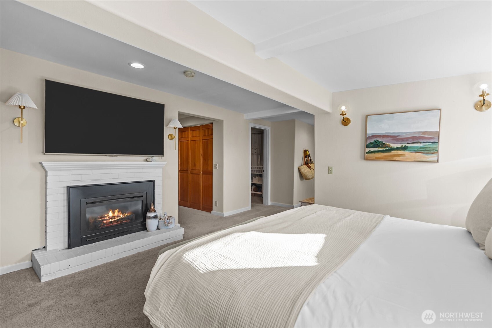 4411 Southwest Othello Street Seattle, WA 98136 - Photo 18 of 36 a bedroom with a bed and a fireplace