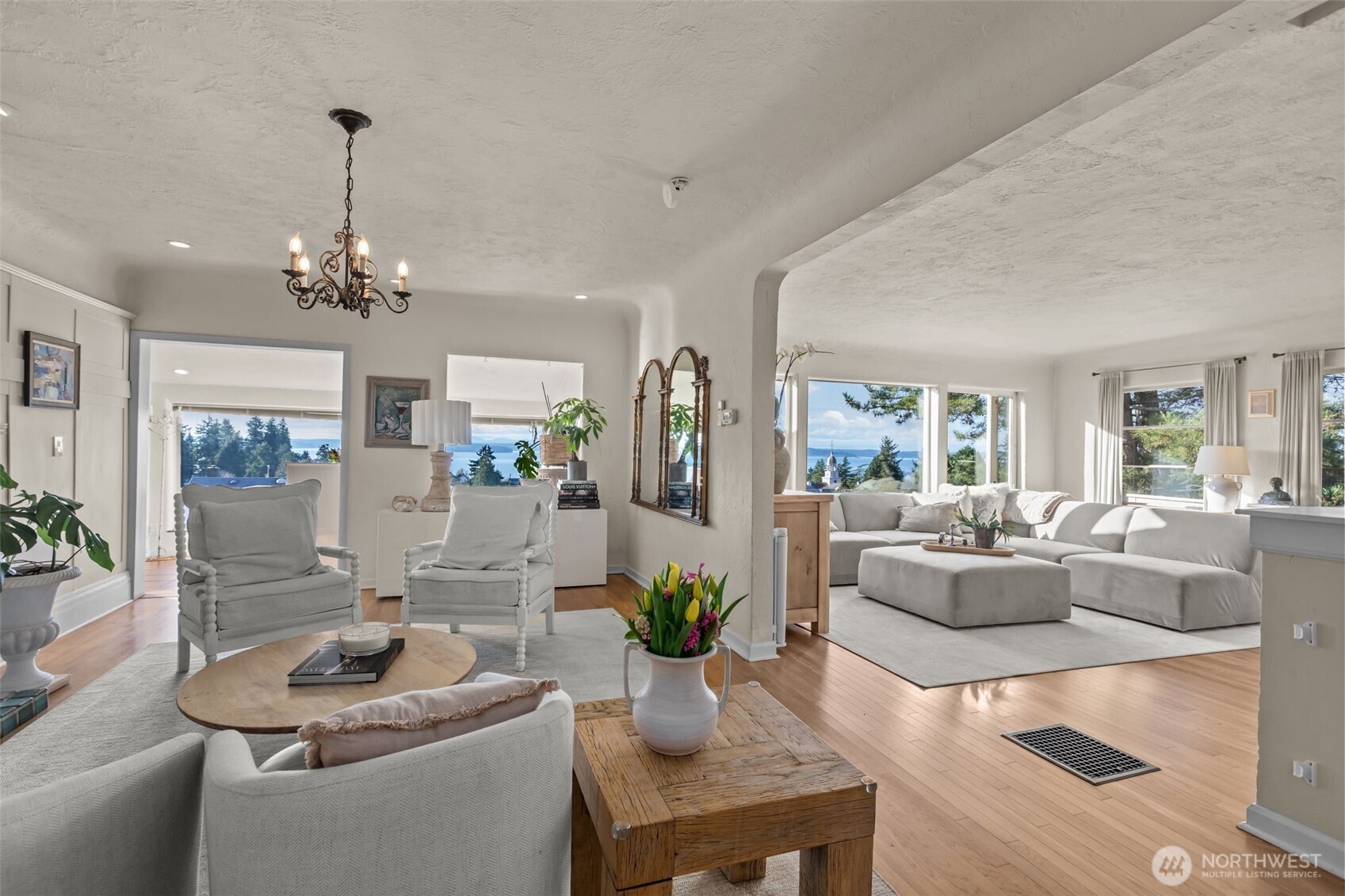 4411 Southwest Othello Street Seattle, WA 98136 - Photo 7 of 36 a living room with furniture and a chandelier