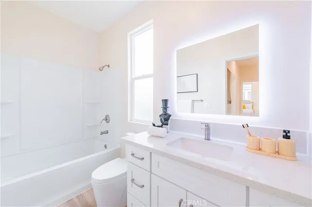 a bathroom with a sink a toilet and a bathtub