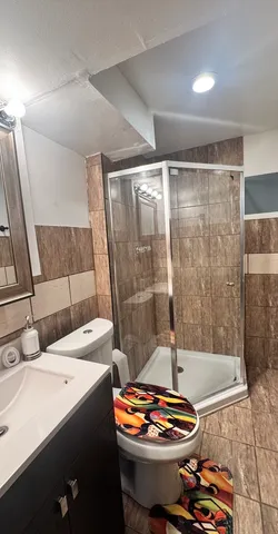 a dining room with a table and chairs