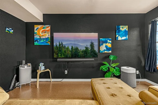 a living room with furniture and flowers