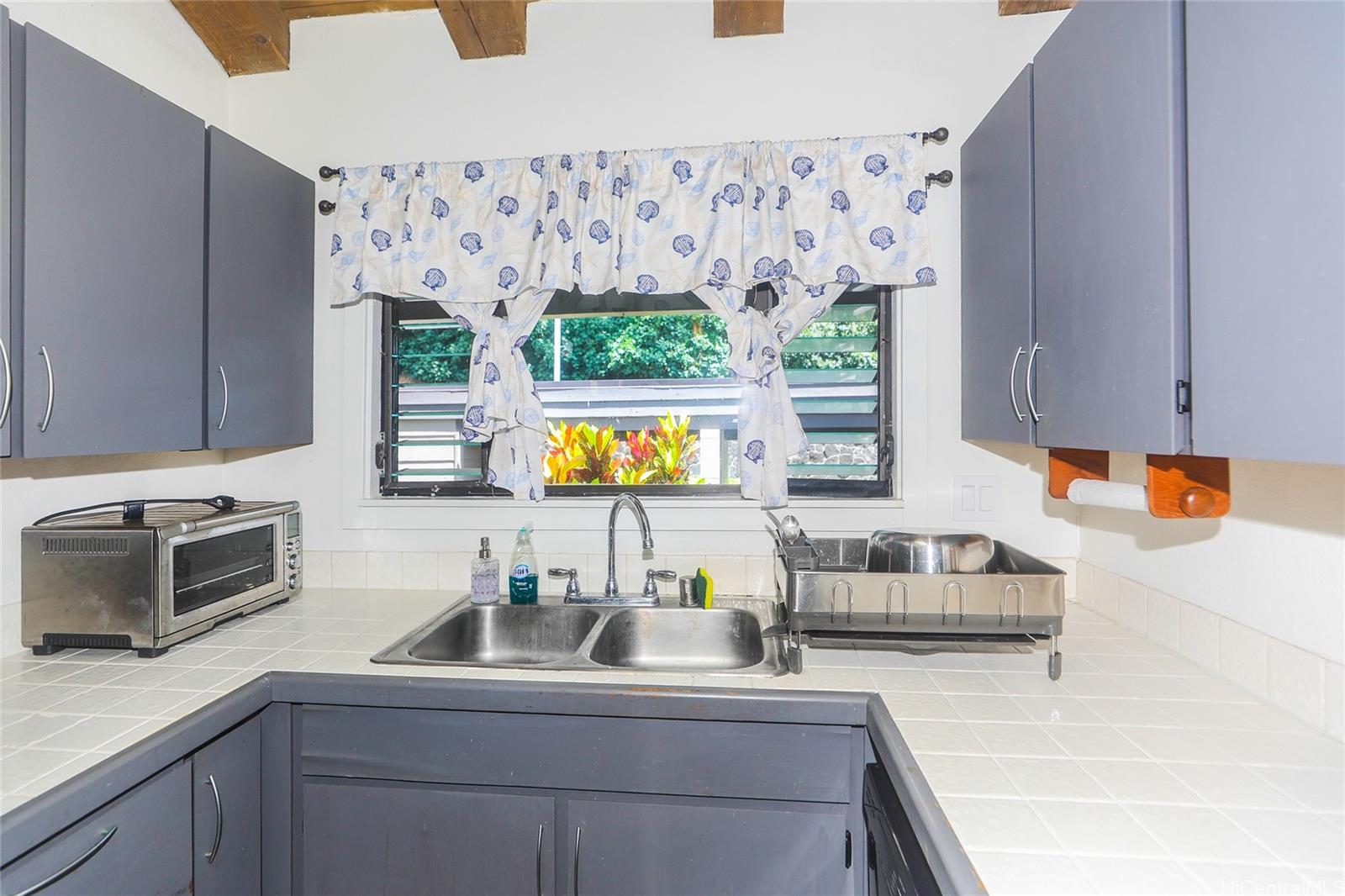 45-995 Wailele Road, Unit 8 Kaneohe, HI 96744 - Photo 16 of 25 The kitchen window allows for natural light and breezes.