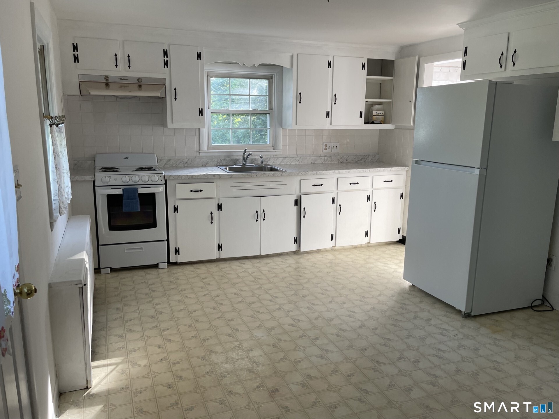 8 Prospect Hill Deep River, CT 06417 - Photo 6 of 16 a kitchen with cabinets appliances and a refrigerator