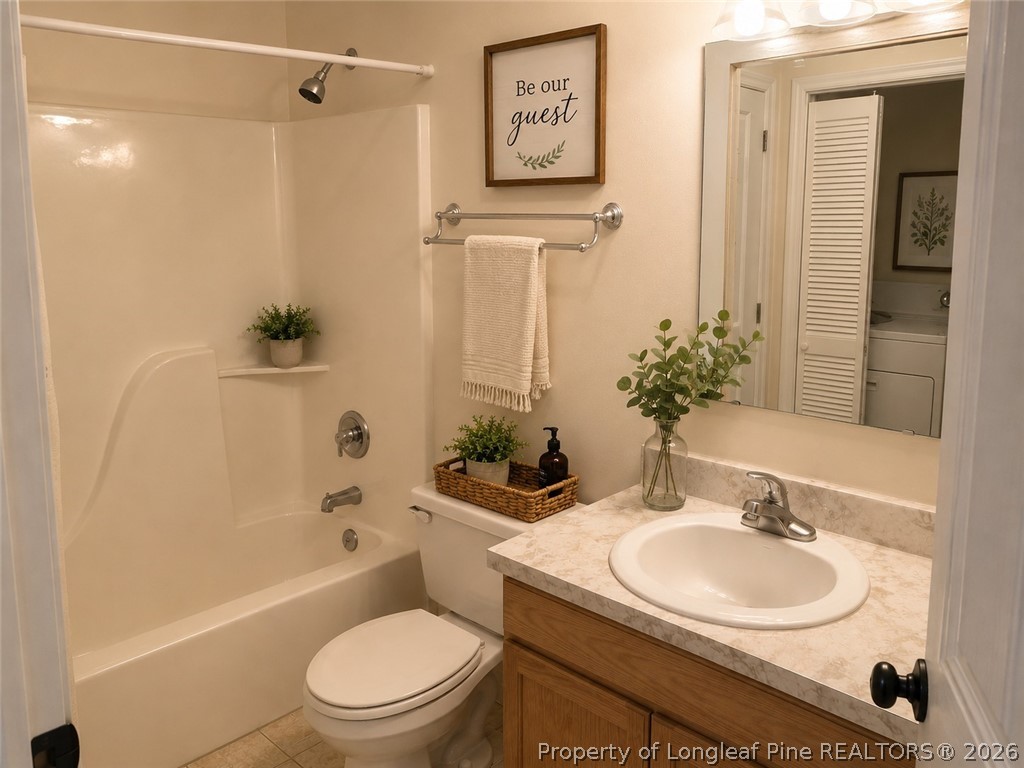 1833 Sardonyx Road, Unit 3 Fayetteville, NC 28303 - Photo 6 of 10 a bathroom with a sink toilet and shower