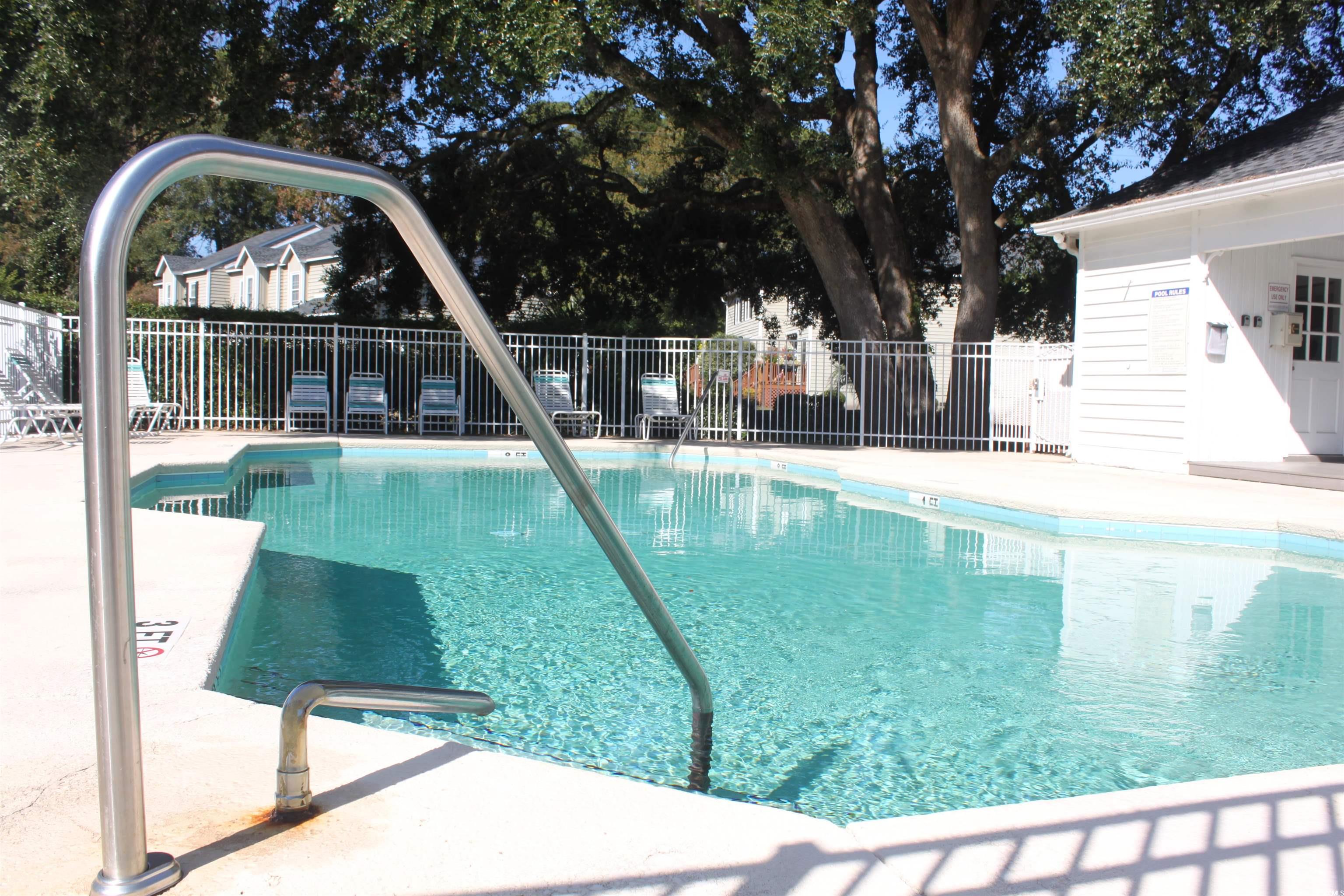 4840 Moss Creek Loop, Unit 36 Murrells Inlet, SC 29576 - Photo 35 of 37 Community pool featuring a patio area