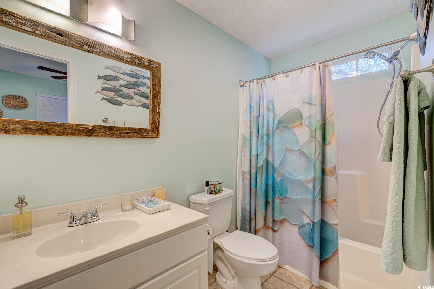 4840 Moss Creek Loop, Unit 36 Murrells Inlet, SC 29576 - Photo 7 of 37 Full bath featuring vanity, shower / bath combination with curtain, and light tile patterned floors
