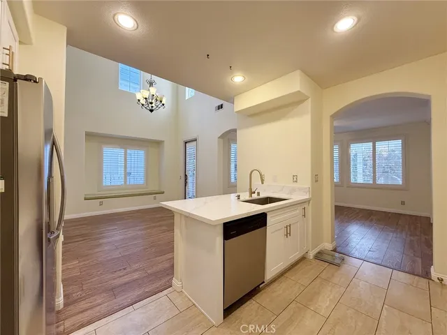 a kitchen with a sink stove and refrigerator