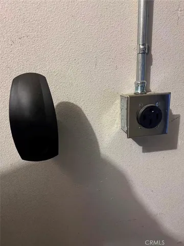 a view of a porch with dining table and chairs with a garden
